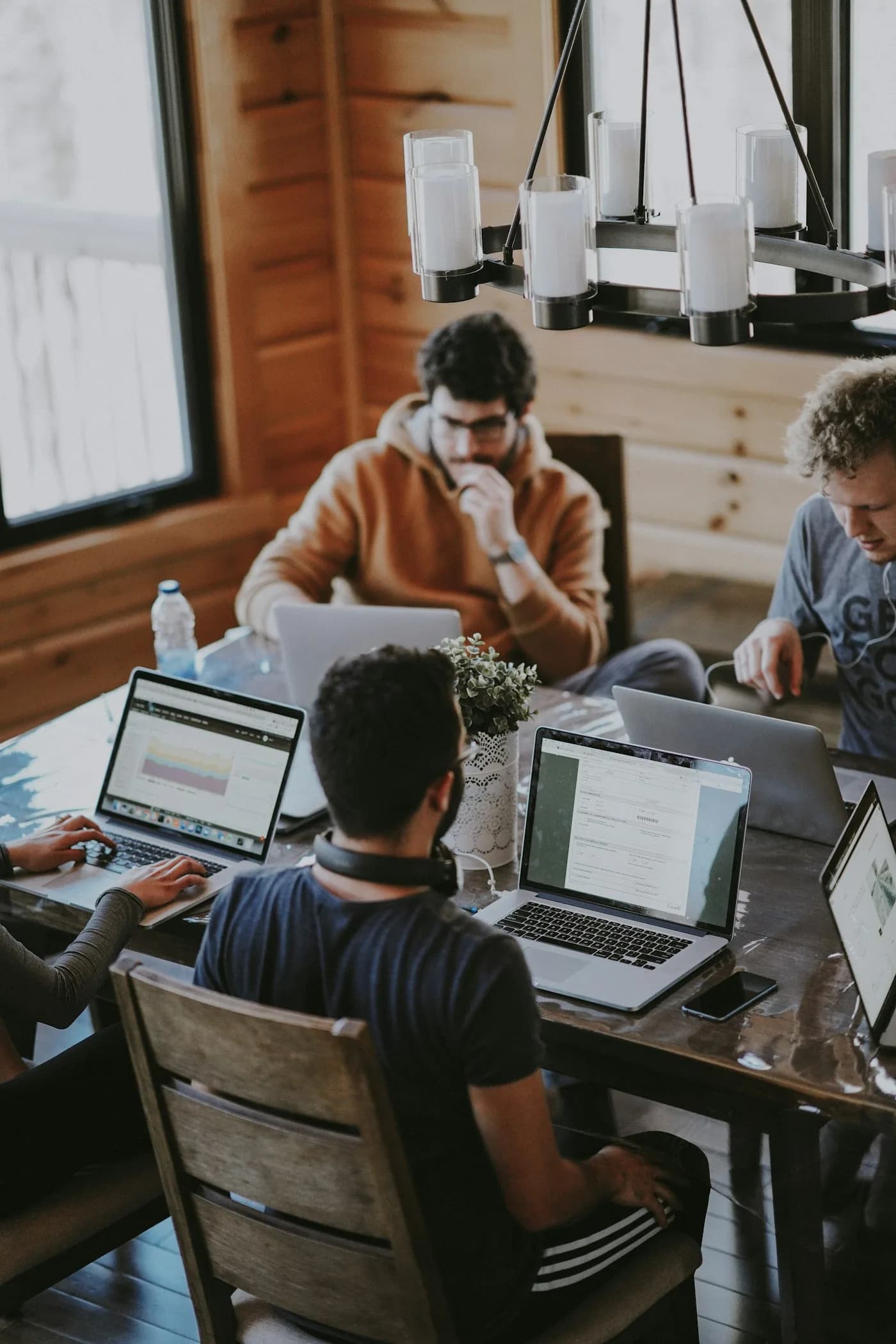 A team collaborating around a shared workspace